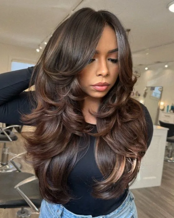 Preview the voluminous butterfly layers look with a virtual hairstyle try-on tool.