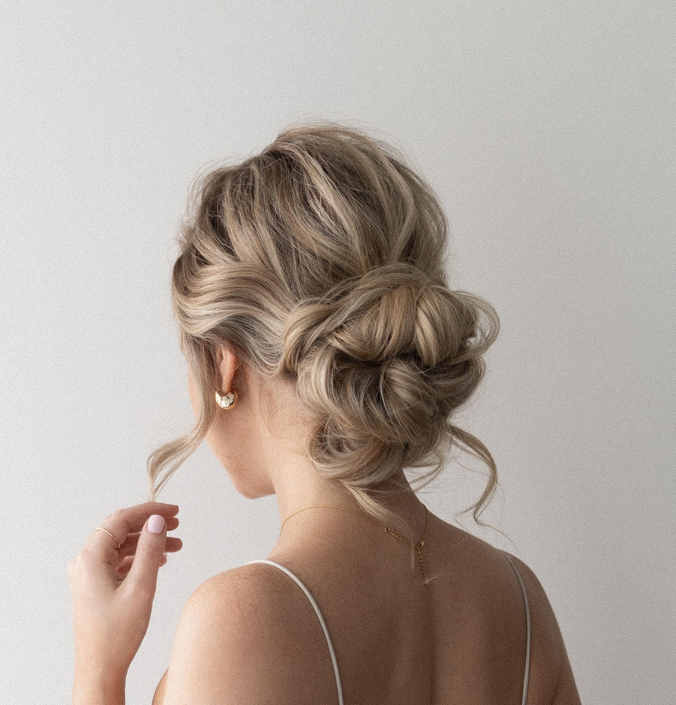 prom hairstyles: low messy bun hairstyle 