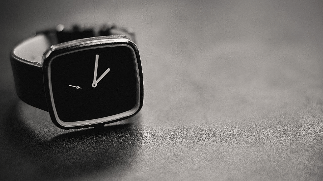 A close-up shot of a minimal wristwatch. 