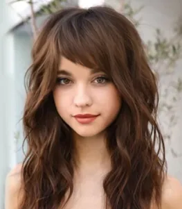 10 Best Slimming Haircuts: Side-Swept Bangs with Long Hair