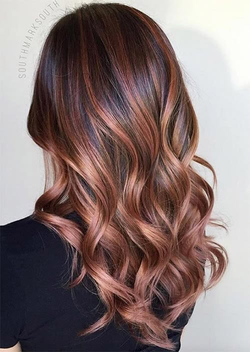 Experiment with warm copper or rose brown shades using virtual hair color try-on.